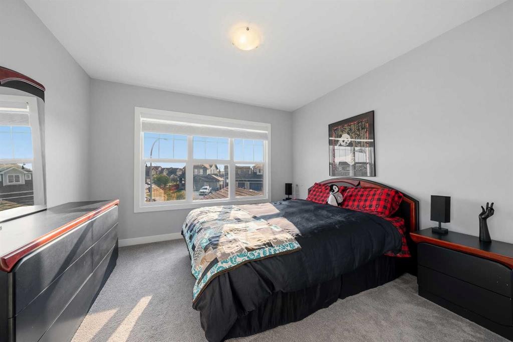 395 Boulder Creek Bay Se, Langdon, AB - Indoor Photo Showing Bedroom