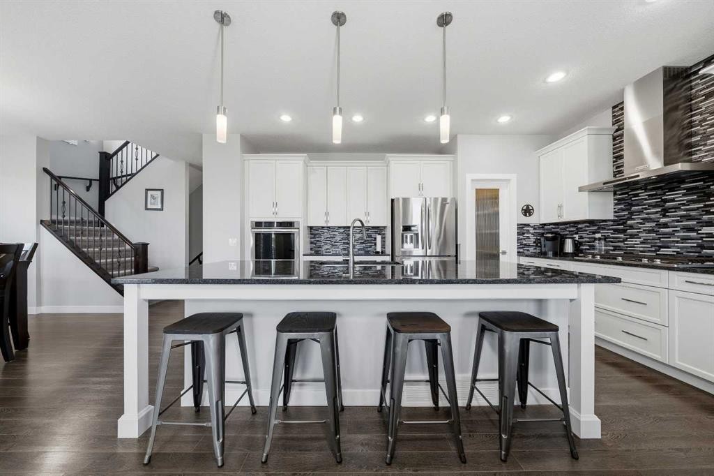 395 Boulder Creek Bay Se, Langdon, AB - Indoor Photo Showing Kitchen With Upgraded Kitchen