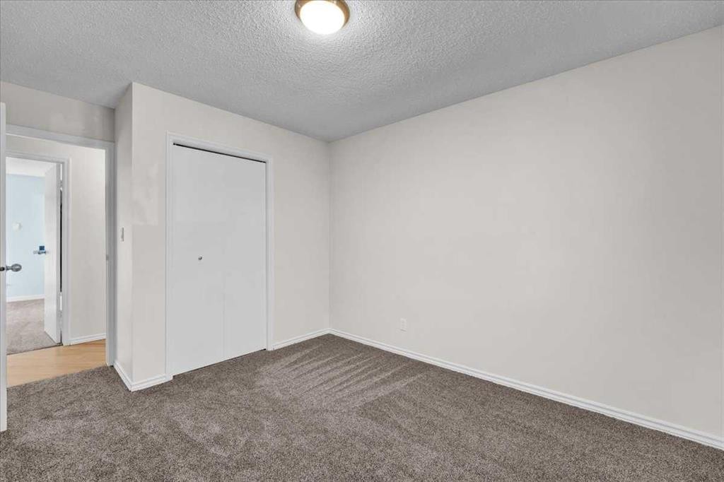 228 Nottingham Road Nw, Calgary, AB - Indoor Photo Showing Other Room