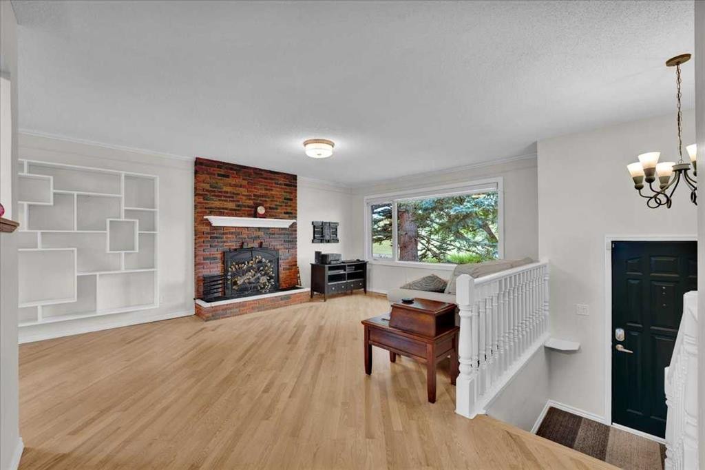 228 Nottingham Road Nw, Calgary, AB - Indoor Photo Showing Living Room With Fireplace