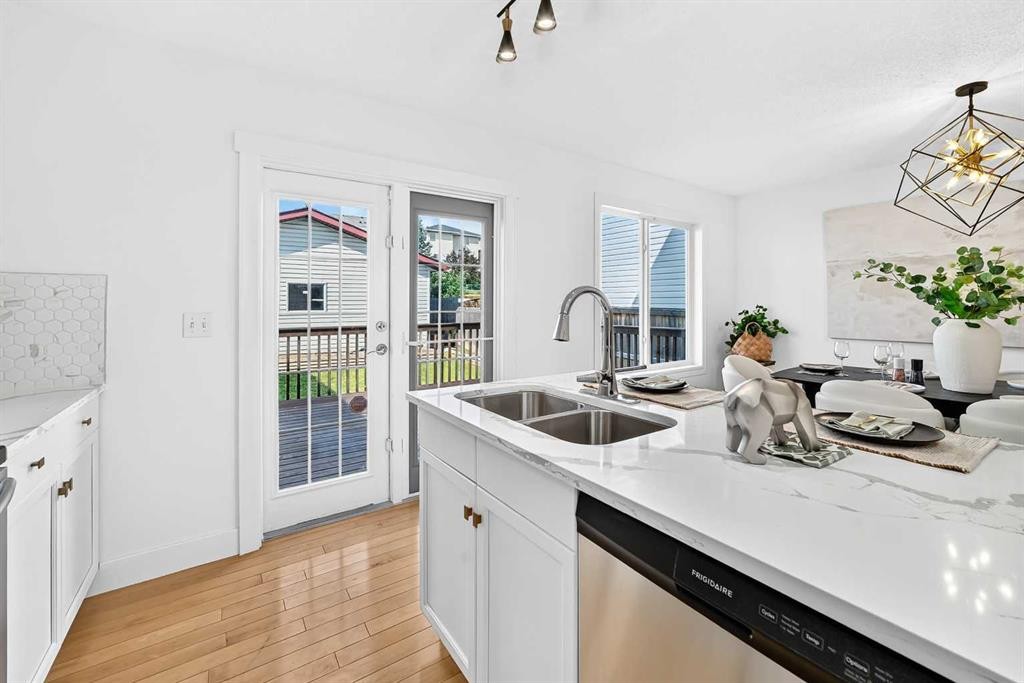 187 Arbour Meadows Close Nw, Calgary, AB - Indoor Photo Showing Kitchen With Double Sink