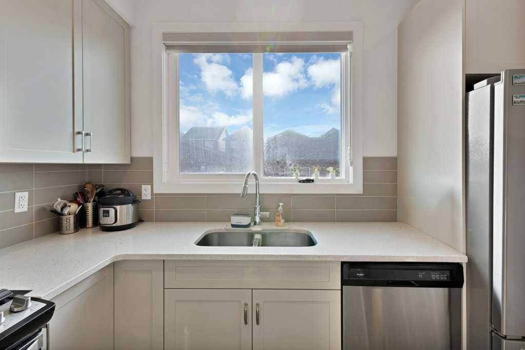 25 Savanna Manor Ne, Calgary, AB - Indoor Photo Showing Kitchen With Double Sink