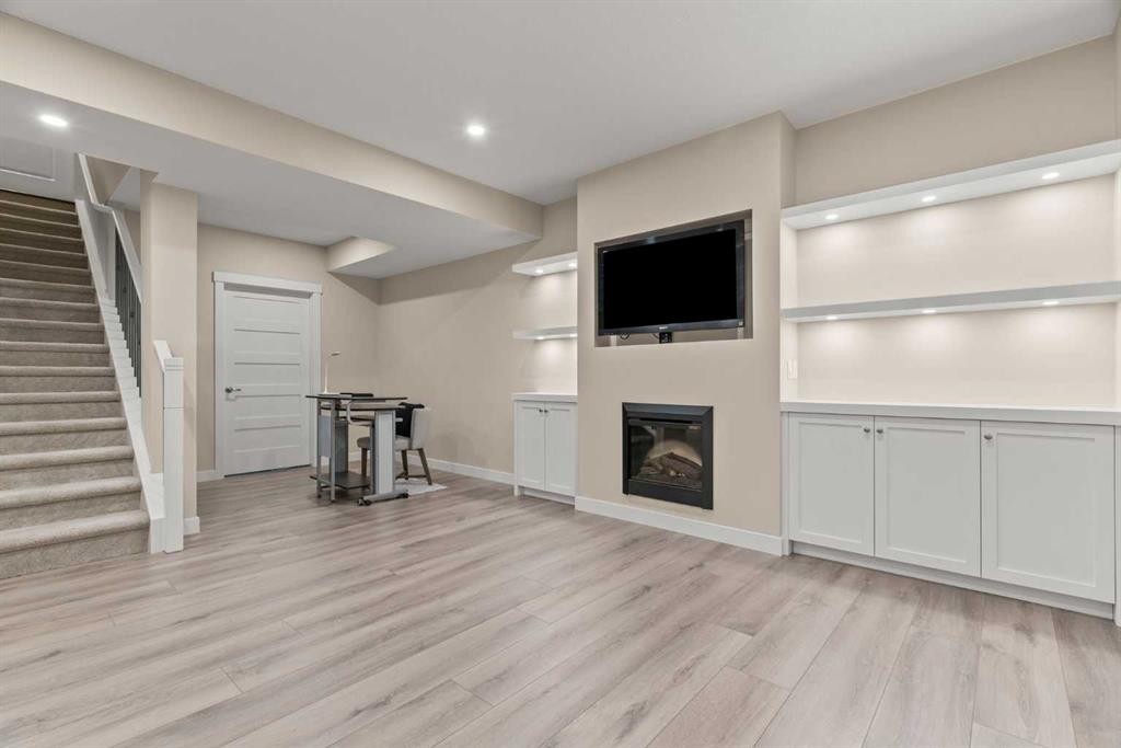 2306 Bayside Circle Sw, Airdrie, AB - Indoor With Fireplace