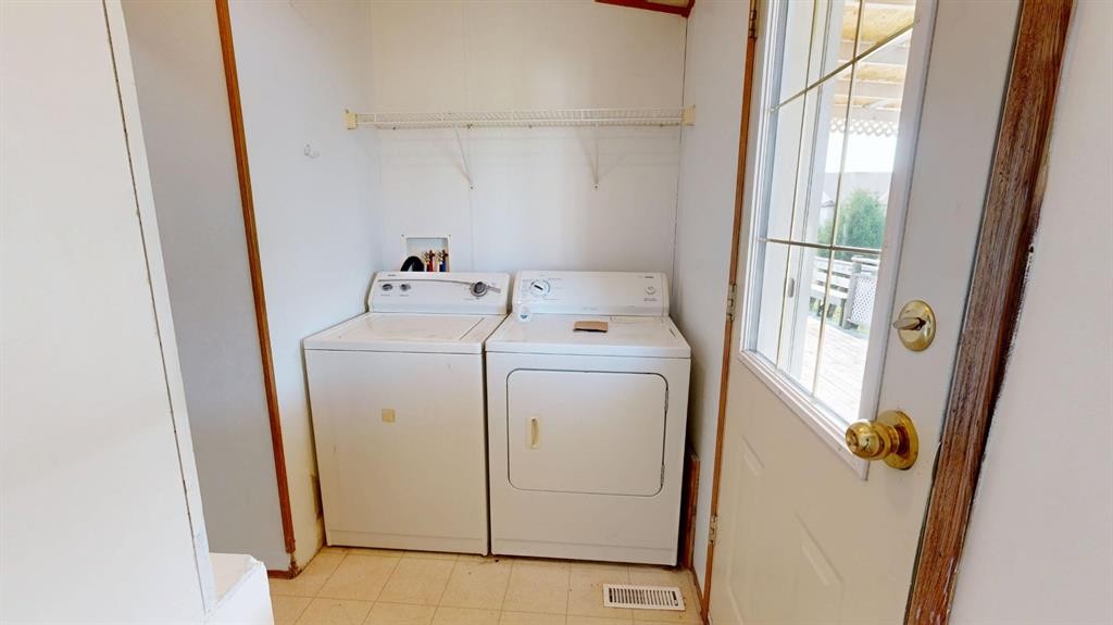 1905 29 Avenue, Nanton, AB - Indoor Photo Showing Laundry Room