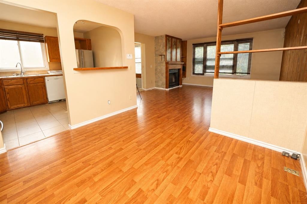 7 Dovercliffe Way Se, Calgary, AB - Indoor Photo Showing Other Room With Fireplace