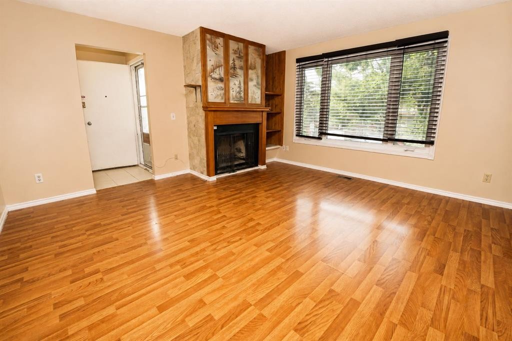 7 Dovercliffe Way Se, Calgary, AB - Indoor Photo Showing Living Room With Fireplace