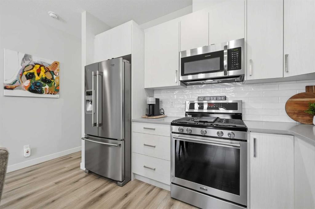 535 Canals Crossing Sw, Airdrie, AB - Indoor Photo Showing Kitchen With Stainless Steel Kitchen With Upgraded Kitchen
