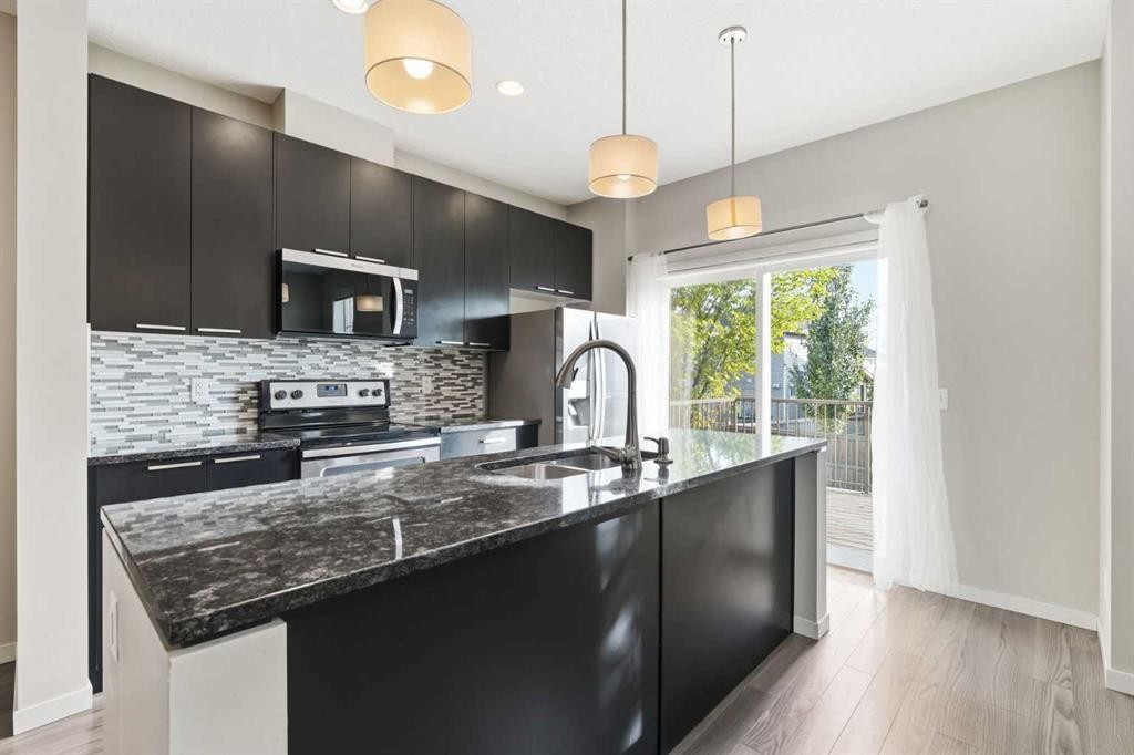 209 Copperpond Row Se, Calgary, AB - Indoor Photo Showing Kitchen With Double Sink With Upgraded Kitchen