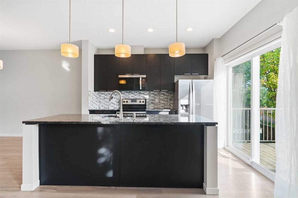 209 Copperpond Row Se, Calgary, AB - Indoor Photo Showing Kitchen With Upgraded Kitchen