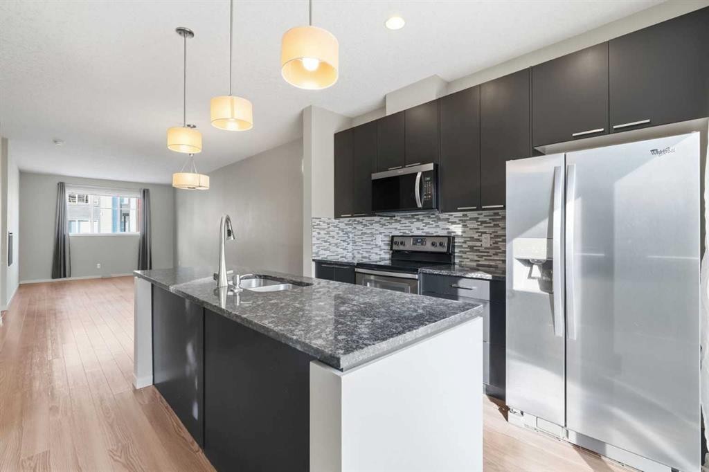 209 Copperpond Row Se, Calgary, AB - Indoor Photo Showing Kitchen With Upgraded Kitchen