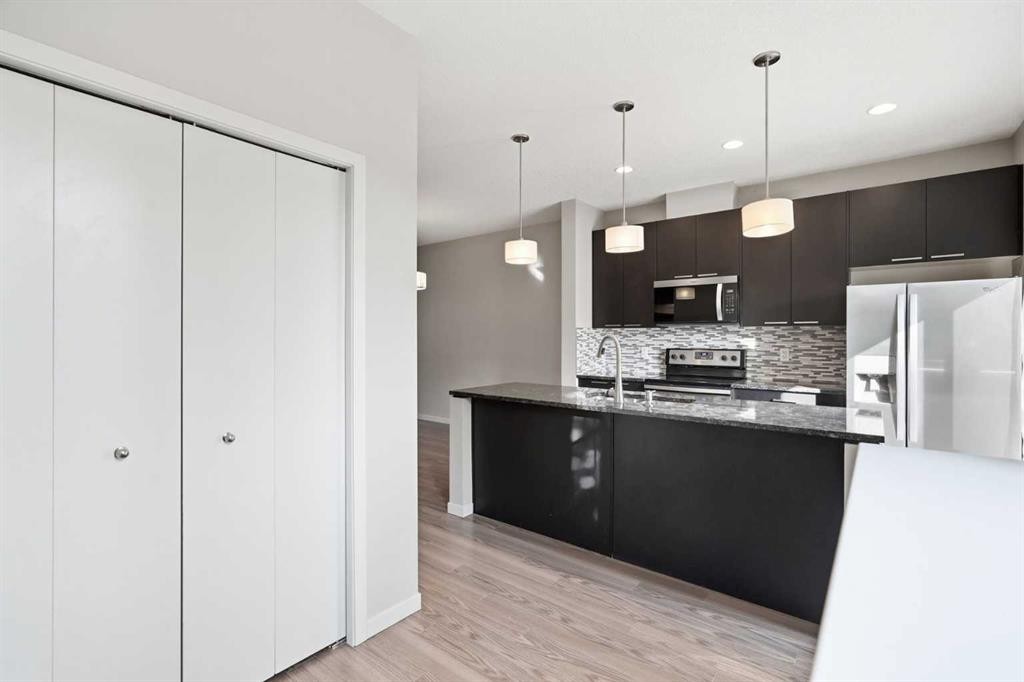 209 Copperpond Row Se, Calgary, AB - Indoor Photo Showing Kitchen With Upgraded Kitchen