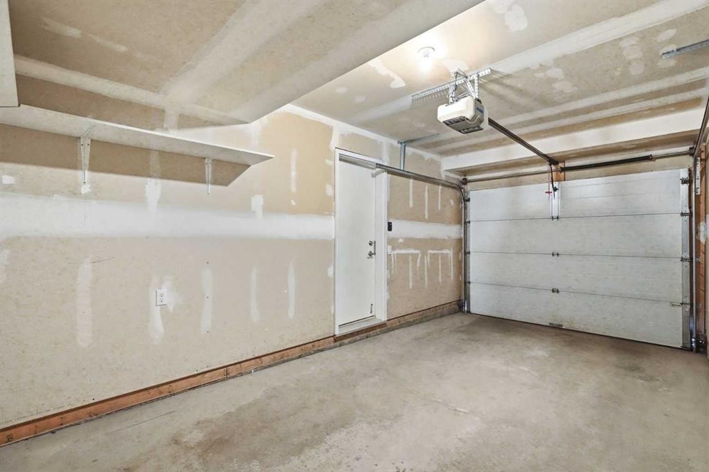 209 Copperpond Row Se, Calgary, AB - Indoor Photo Showing Garage