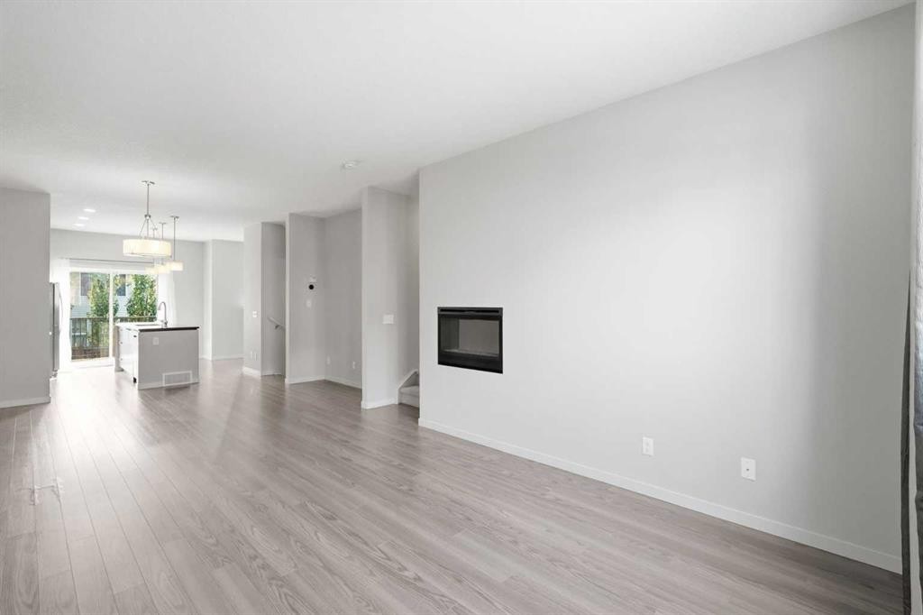 209 Copperpond Row Se, Calgary, AB - Indoor Photo Showing Living Room