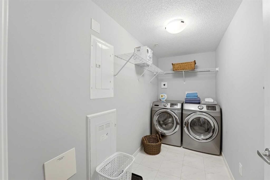 212-4150 Seton Drive Sw, Calgary, AB - Indoor Photo Showing Laundry Room