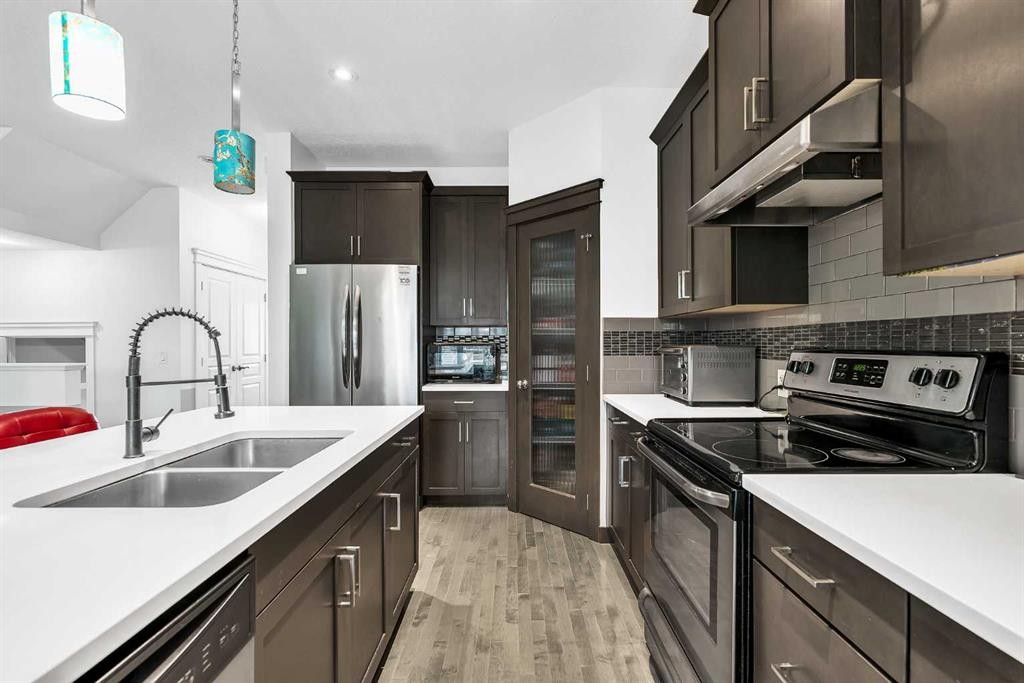 154 Redstone Common Ne, Calgary, AB - Indoor Photo Showing Kitchen With Stainless Steel Kitchen With Double Sink With Upgraded Kitchen
