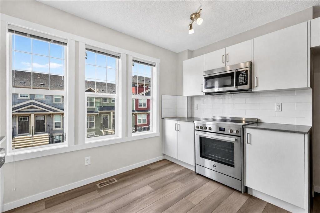 246 Cranbrook Square Se, Calgary, AB - Indoor Photo Showing Kitchen With Stainless Steel Kitchen