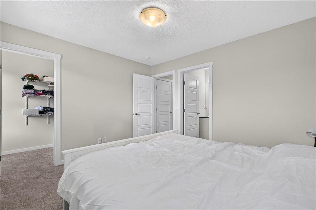 246 Cranbrook Square Se, Calgary, AB - Indoor Photo Showing Bedroom