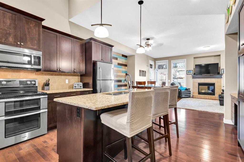 21 Evansfield Way Nw, Calgary, AB - Indoor Photo Showing Kitchen With Fireplace