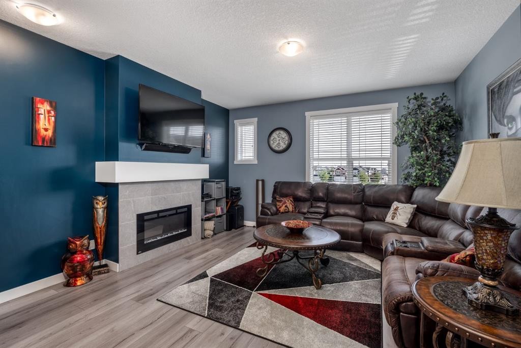 258 Copperleaf Way Se, Calgary, AB - Indoor Photo Showing Living Room With Fireplace