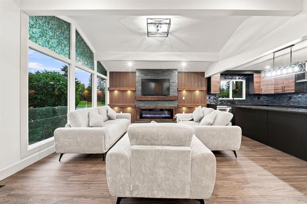 8304 11 Street Sw, Calgary, AB - Indoor Photo Showing Living Room With Fireplace