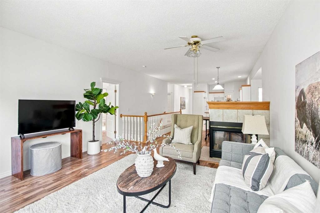 21 Scimitar Heath Nw, Calgary, AB - Indoor Photo Showing Living Room With Fireplace