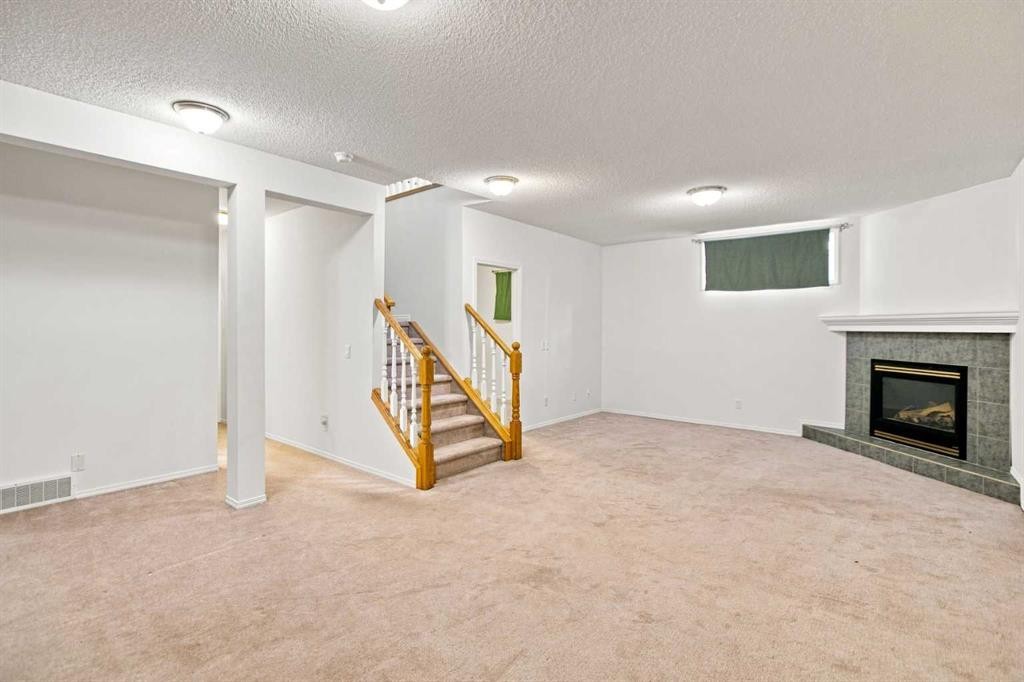 21 Scimitar Heath Nw, Calgary, AB - Indoor With Fireplace