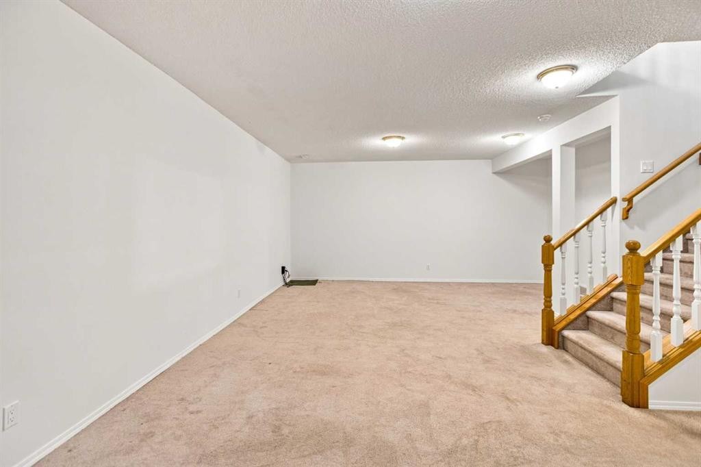 21 Scimitar Heath Nw, Calgary, AB - Indoor Photo Showing Other Room
