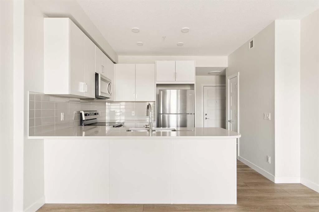 218-55 Wolf Hollow Crescent Se, Calgary, AB - Indoor Photo Showing Kitchen With Stainless Steel Kitchen With Double Sink