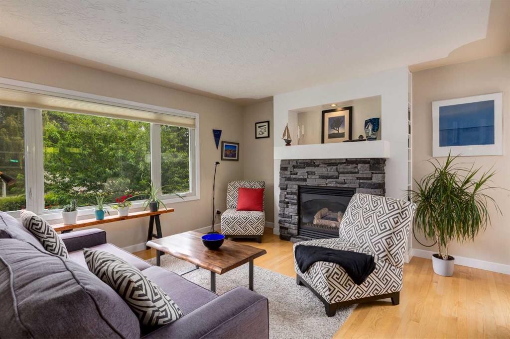4903 Carney Road Nw, Calgary, AB - Indoor Photo Showing Living Room With Fireplace