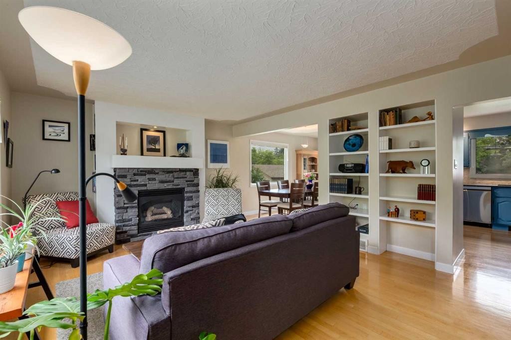 4903 Carney Road Nw, Calgary, AB - Indoor Photo Showing Living Room With Fireplace