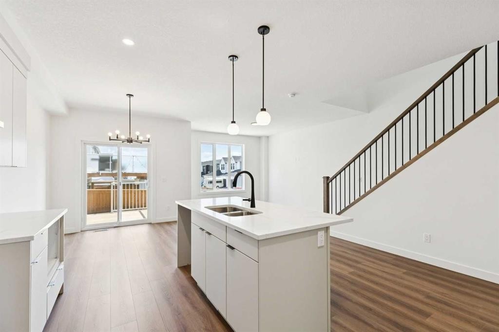 69 Heritage Park, Cochrane, AB - Indoor Photo Showing Kitchen With Double Sink