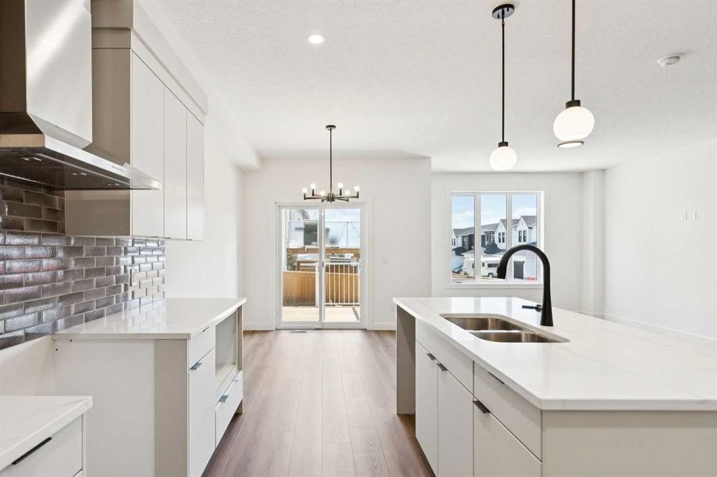 69 Heritage Park, Cochrane, AB - Indoor Photo Showing Kitchen With Double Sink With Upgraded Kitchen