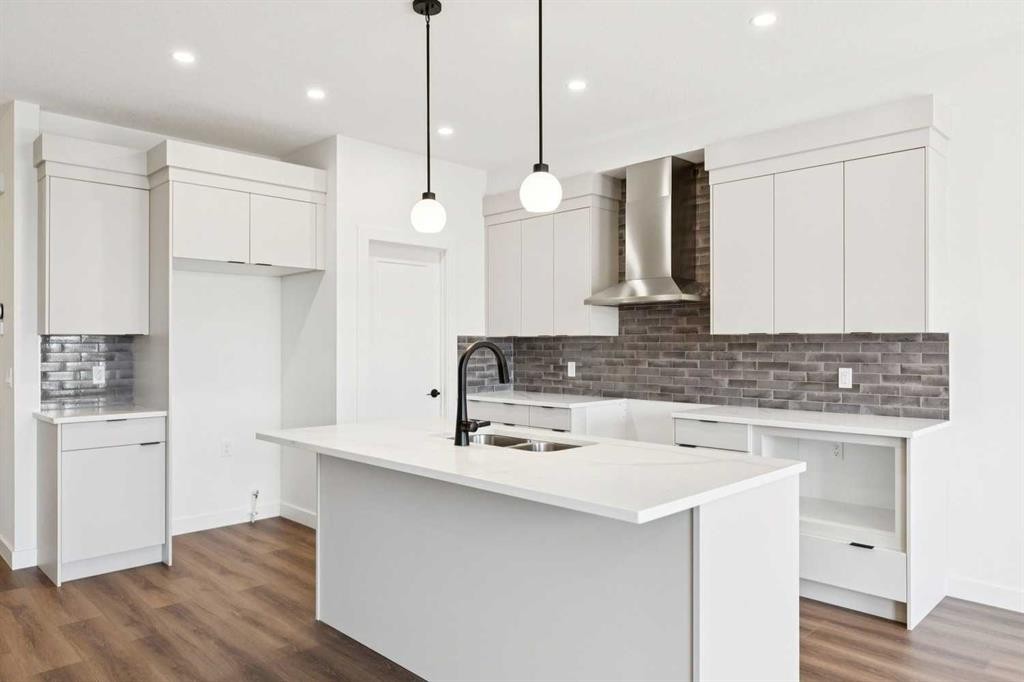 69 Heritage Park, Cochrane, AB - Indoor Photo Showing Kitchen With Double Sink With Upgraded Kitchen