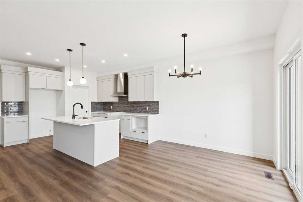 69 Heritage Park, Cochrane, AB - Indoor Photo Showing Kitchen With Upgraded Kitchen