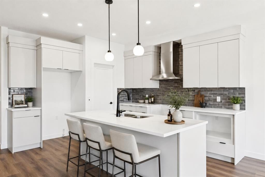 69 Heritage Park, Cochrane, AB - Indoor Photo Showing Kitchen With Double Sink With Upgraded Kitchen