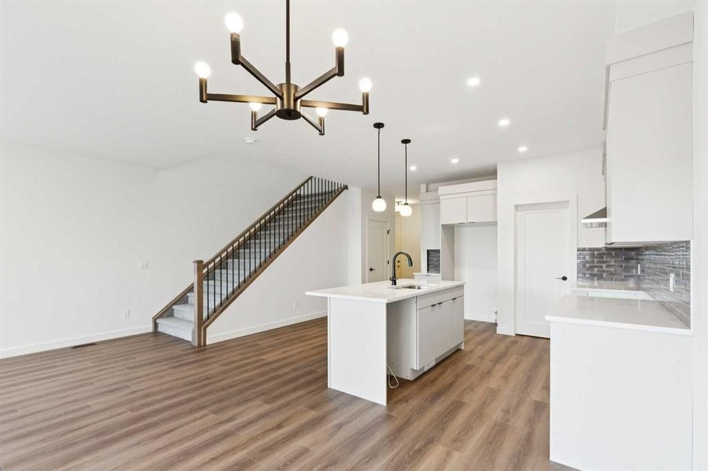 69 Heritage Park, Cochrane, AB - Indoor Photo Showing Kitchen With Upgraded Kitchen