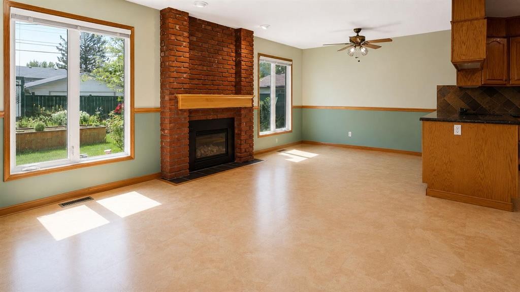 1027 Lake Sylvan Drive Se, Calgary, AB - Indoor Photo Showing Living Room With Fireplace