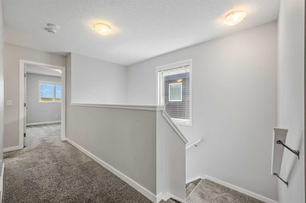 244 Sundown View, Cochrane, AB - Indoor Photo Showing Other Room