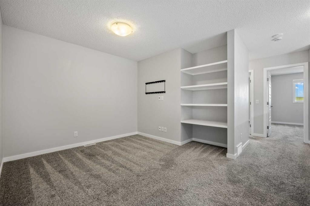 244 Sundown View, Cochrane, AB - Indoor Photo Showing Other Room