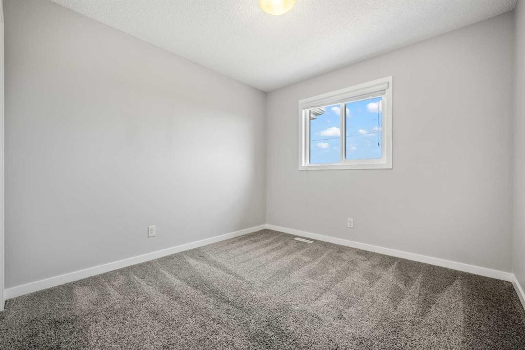 244 Sundown View, Cochrane, AB - Indoor Photo Showing Other Room