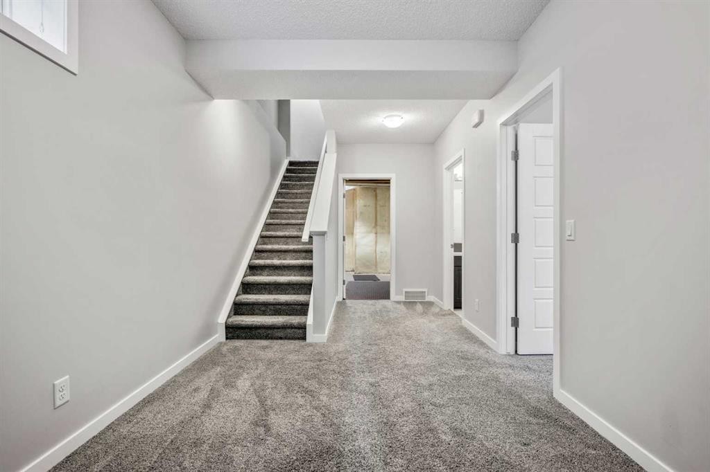 244 Sundown View, Cochrane, AB - Indoor Photo Showing Other Room