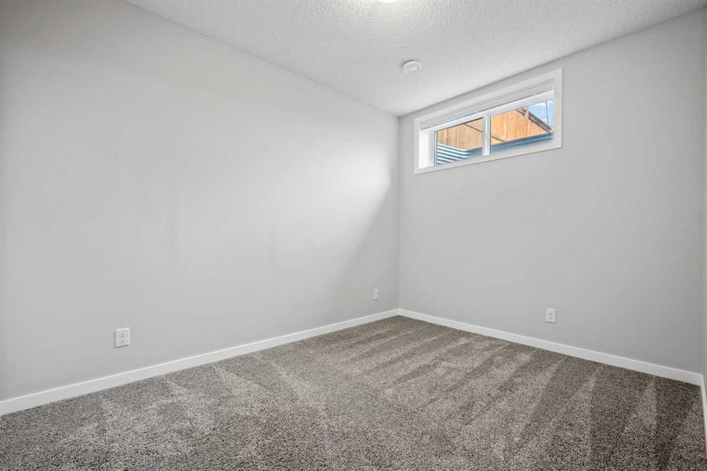 244 Sundown View, Cochrane, AB - Indoor Photo Showing Other Room