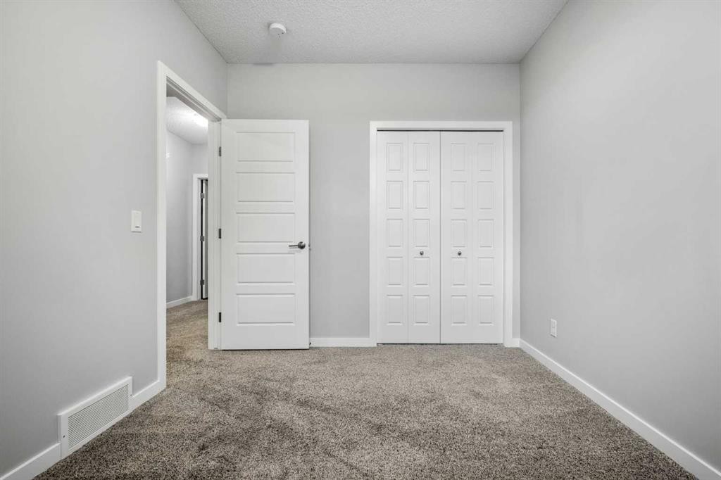 244 Sundown View, Cochrane, AB - Indoor Photo Showing Other Room