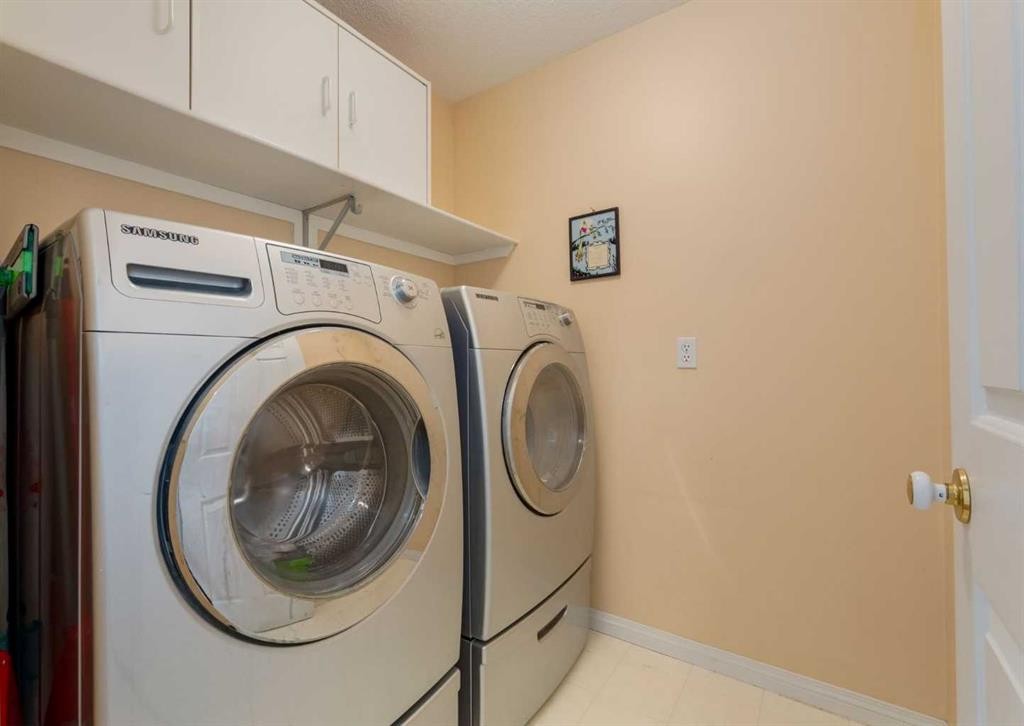 63 Arbour Lake Drive Nw, Calgary, AB - Indoor Photo Showing Laundry Room