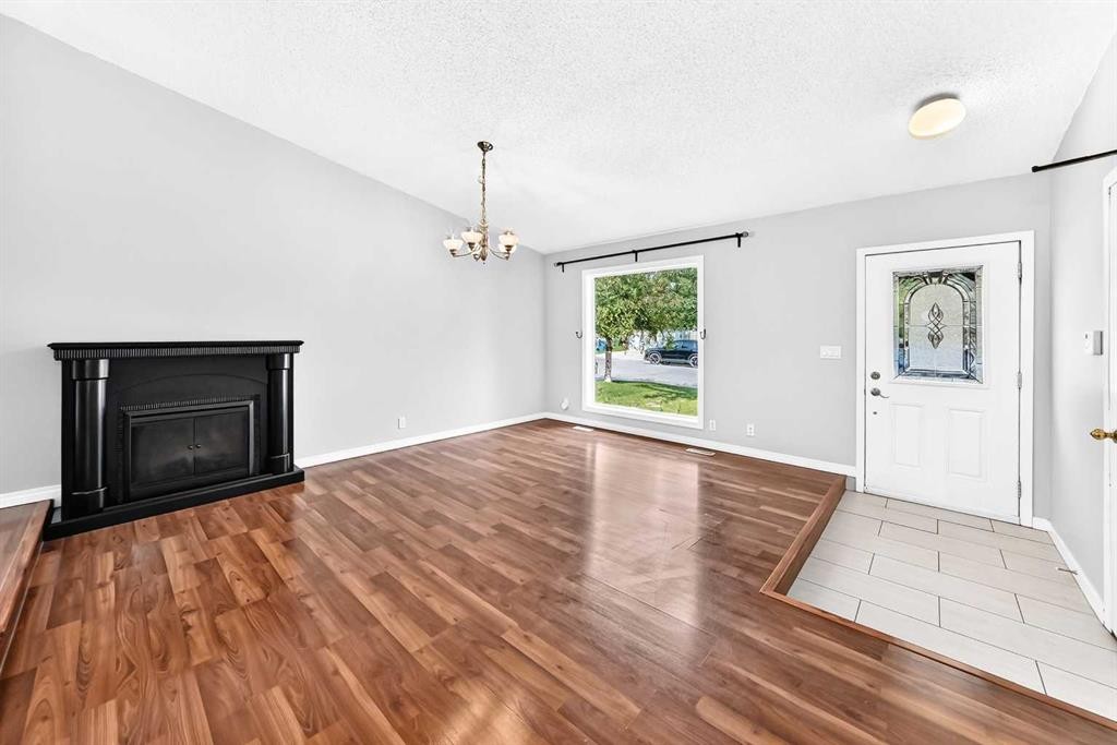 8 Hawkfield Crescent Nw, Calgary, AB - Indoor Photo Showing Living Room With Fireplace