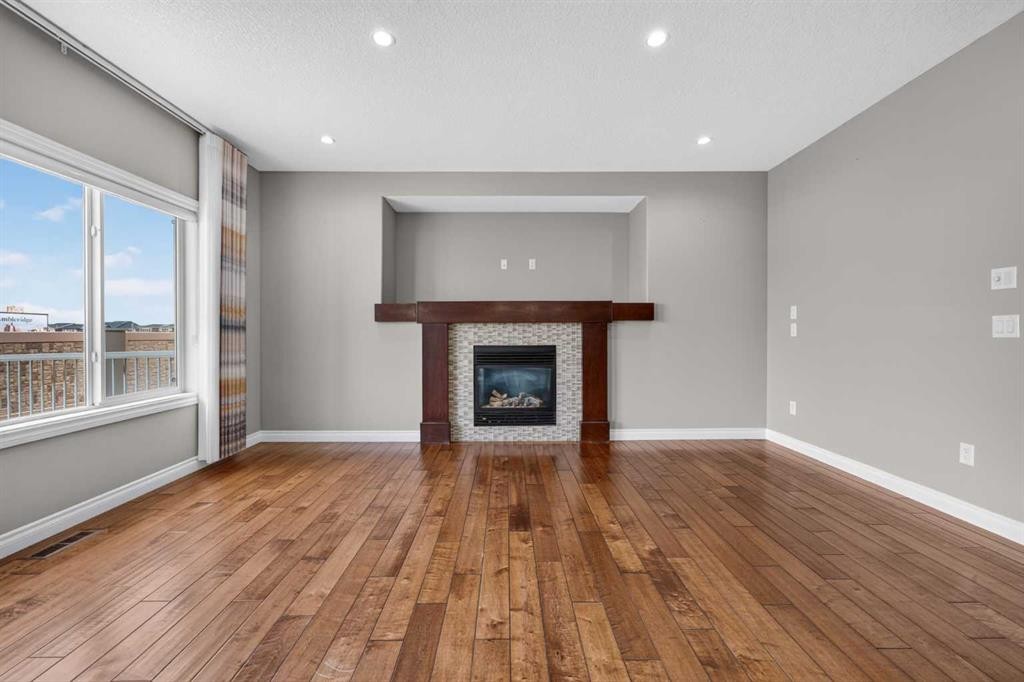 148 Evansborough Way Nw, Calgary, AB - Indoor Photo Showing Living Room With Fireplace