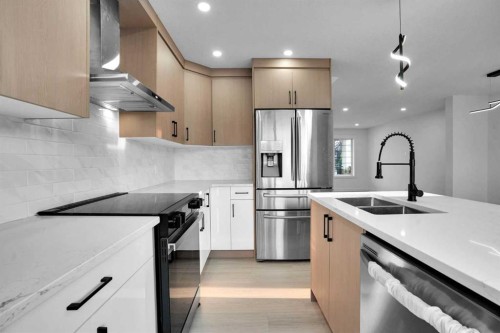 78 Saddlecrest Place Ne, Calgary, AB - Indoor Photo Showing Kitchen With Double Sink With Upgraded Kitchen