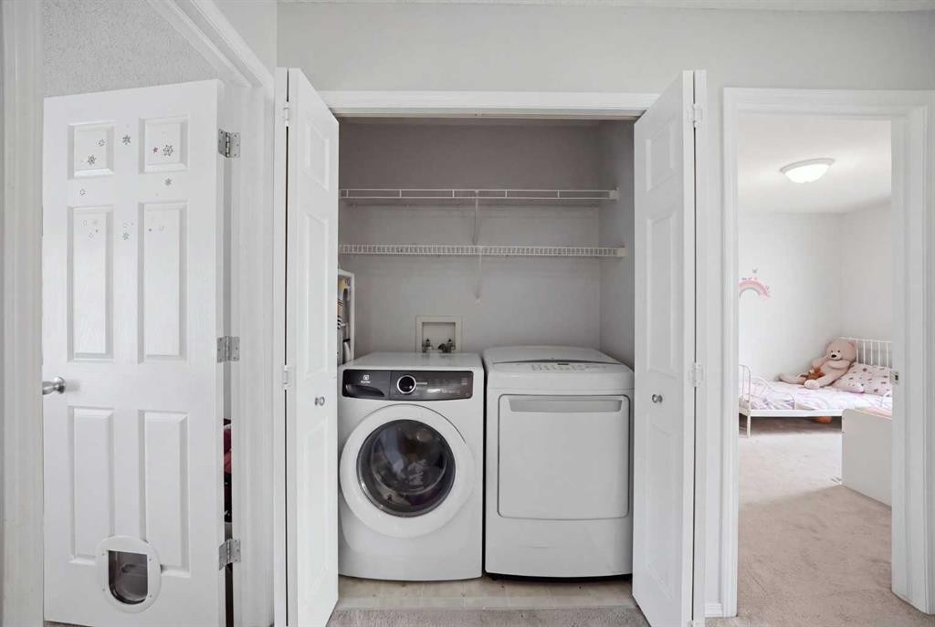 47 Bridlewood View Sw, Calgary, AB - Indoor Photo Showing Laundry Room