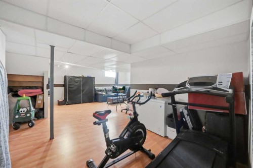 47 Bridlewood View Sw, Calgary, AB - Indoor Photo Showing Gym Room