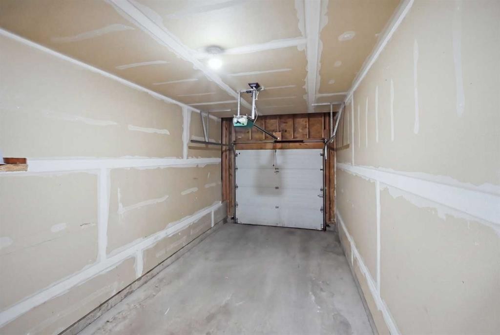 47 Bridlewood View Sw, Calgary, AB - Indoor Photo Showing Garage